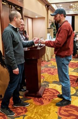 Natoli Engineering Worker Receiving Gift at Christmas in 2018