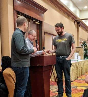 Natoli Engineering Worker Receiving Gift at Christmas in 2018