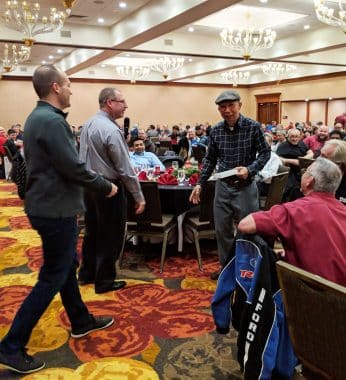 Natoli Engineering Worker Receiving Gift at Christmas in 2018